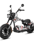 A custom chopper-style electric motorcycle with a black frame, black wheels, and a white, black, and red graffiti-style graphic pattern on the fuel tank and side panels, shown on a solid white background.
