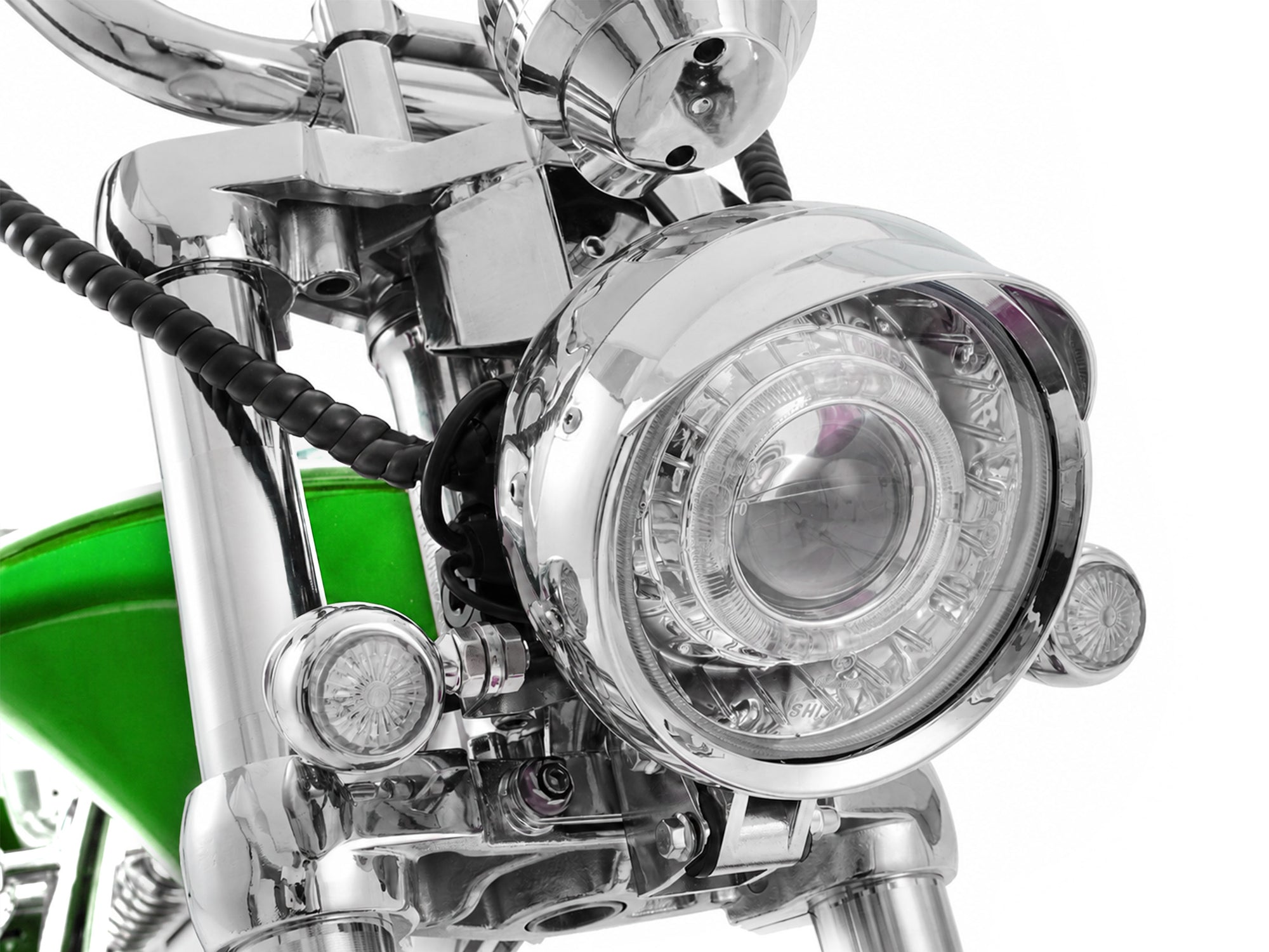 Detailed view of the dual-headlight and turn signal setup on a chopper electric motorcycle