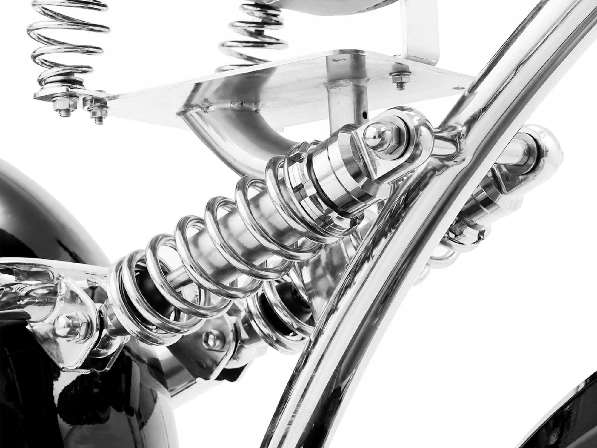 High-detail shot of the rear shock absorber designed for a chopper electric motorcycle