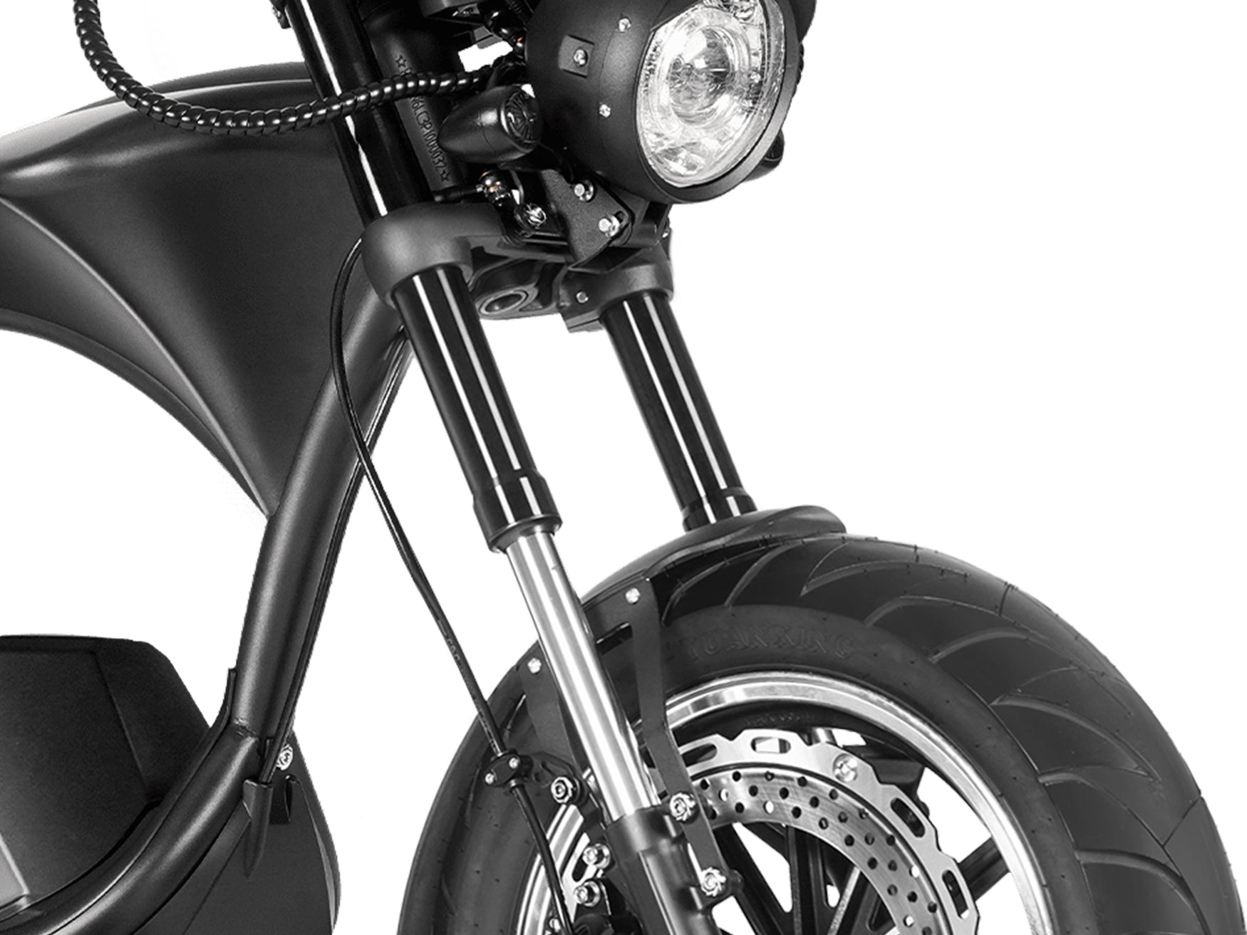 Close-up of the front fork and disc brake on a matte black chopper-style electric motorcycle
