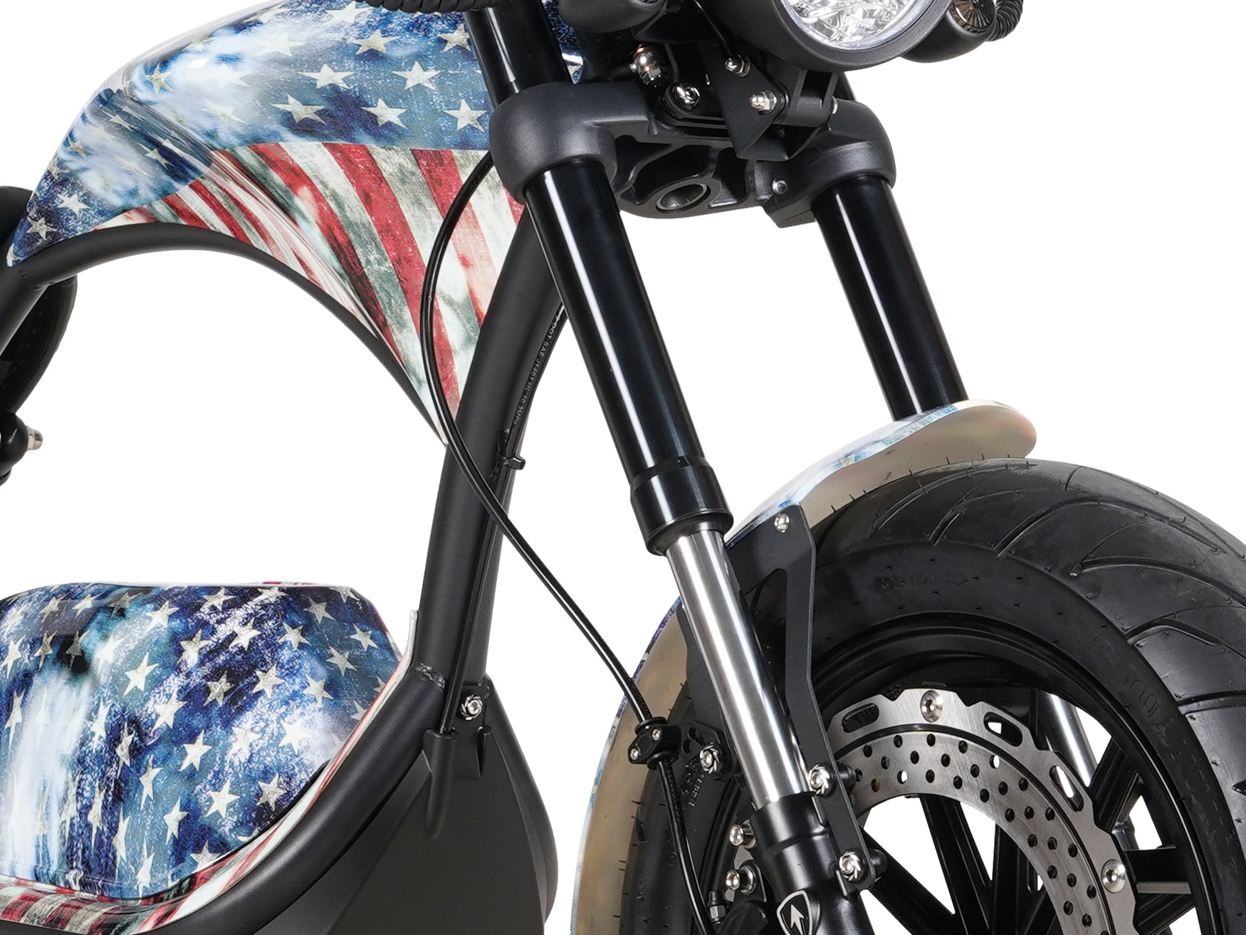 Close-up of the black front fork suspension on the Old Glory Eahora M1PS chopper