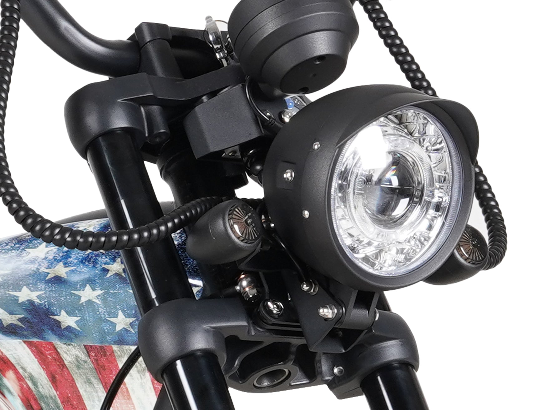 Detailed shot of the headlight system on the Eahora M1PS chopper with Old Glory